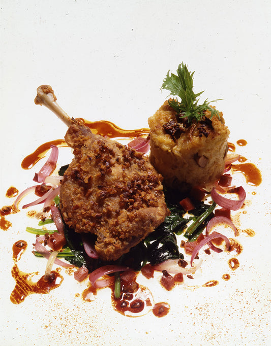 Foie Gras and Sweet Onion Bread Pudding with Pecan-Crusted Duck Leg Confit, Wilted Spinach, and Andouille Salad